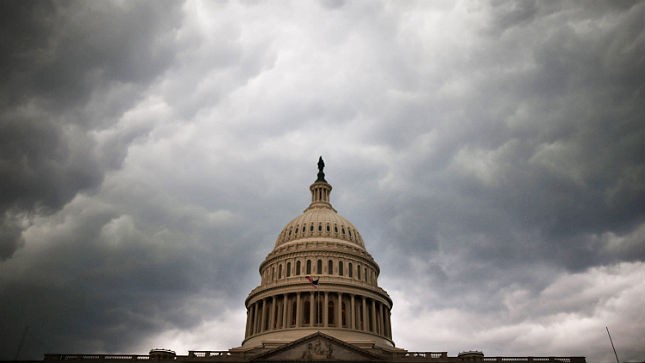 The U.S. Capitol is seen against an overcast sky.