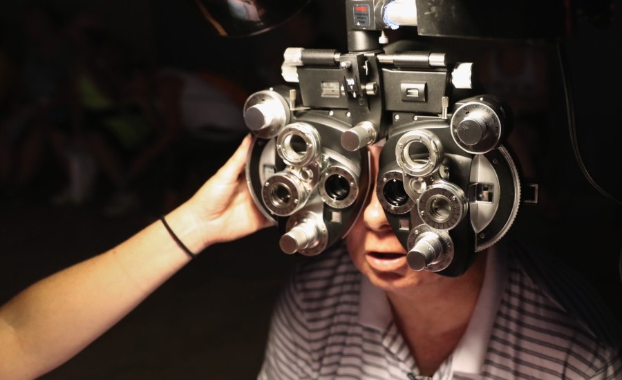 Photo showing person getting an eye exam, bionic eye, eyesight, blindness