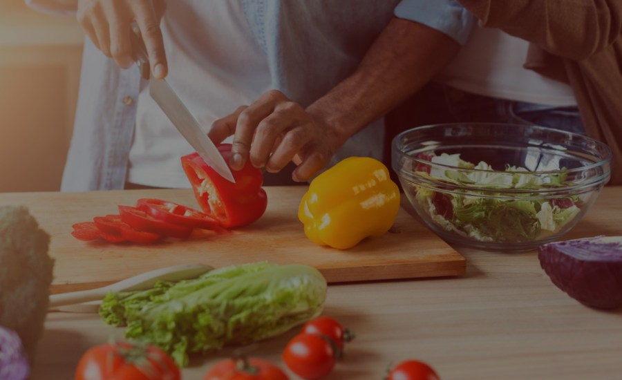 a photo of a chef chopping vegetables