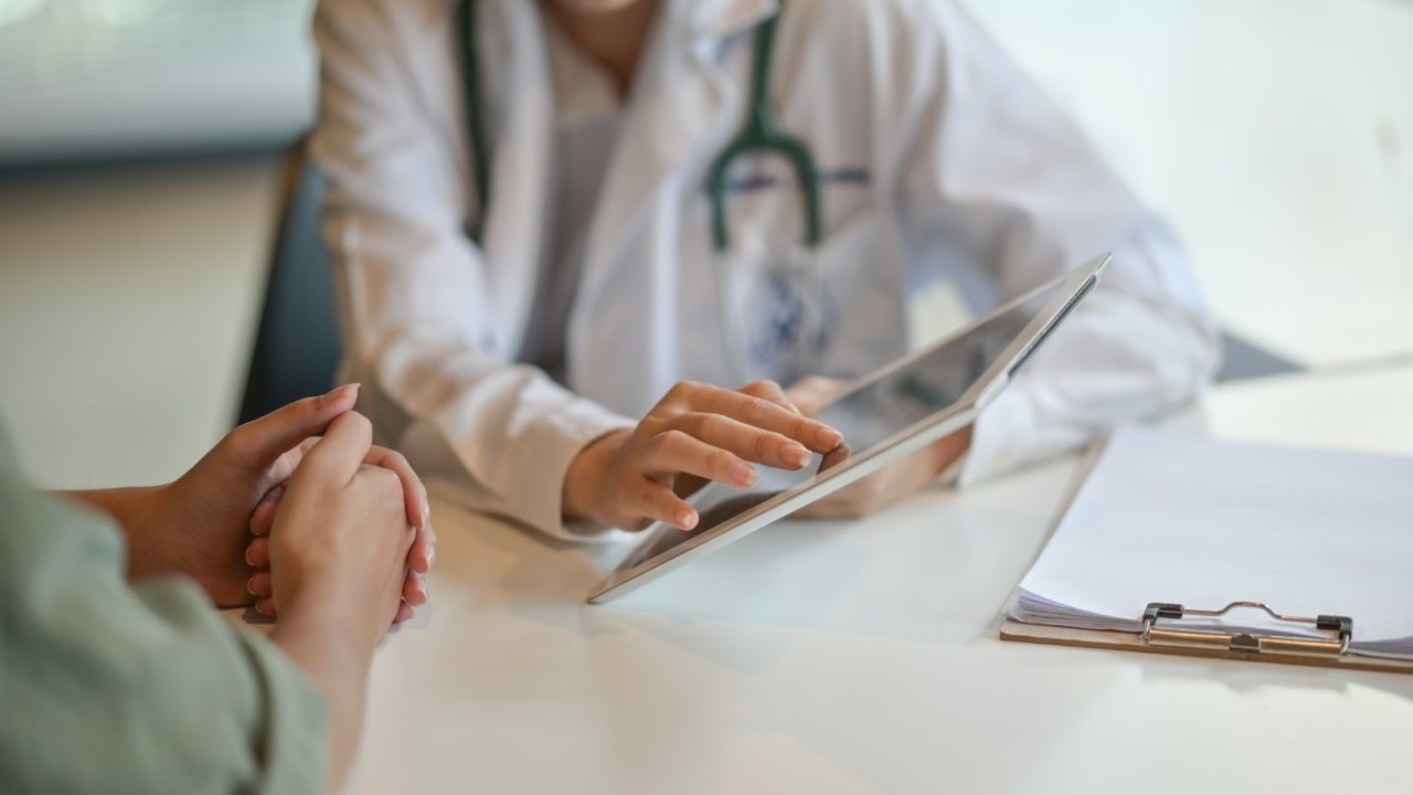 A doctor explains test results to patient