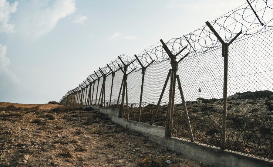 a barbed wire fence on the us-mexican border