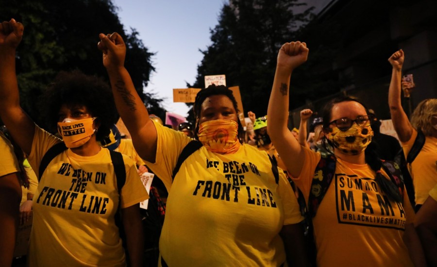 People gather in protest in front of a federal courthouse in downtown Portland as the city experiences another night of unrest on July 26, 2020.