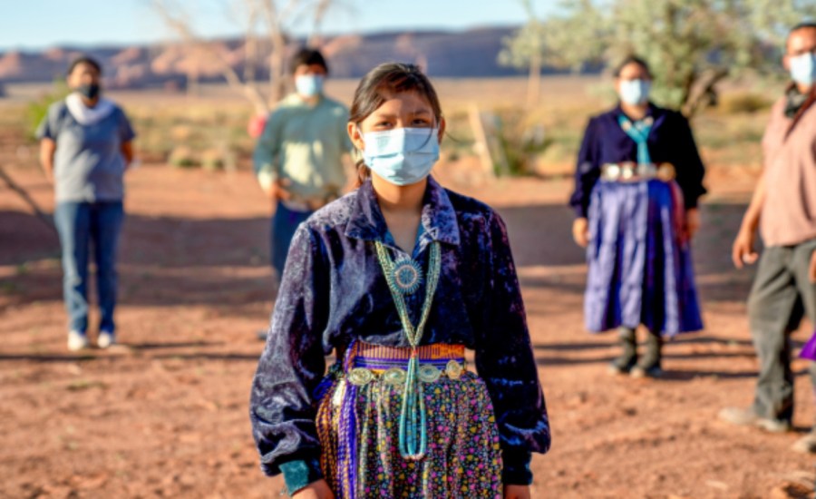 indigenous people in blue clinical masks to protect against coronavirus