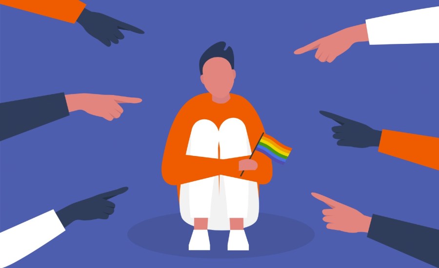 Sad male character hugging his knees holding an LGBTQ+ flag while hands point fingers at him