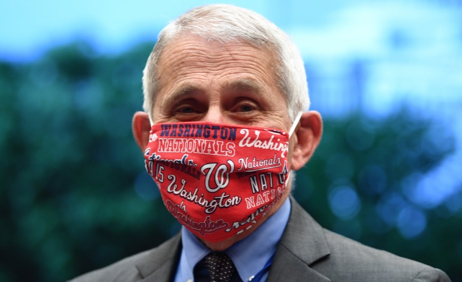 Director of the National Institute for Allergy and Infectious Diseases Dr. Anthony Fauci is see with a Washington Nationals face mask when he arrives to testify during the US Senate Health, Education, Labor, and Pensions Committee hearing to examine COVID