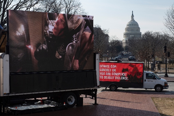 Screen shows Capitol Police officer trapped between doors