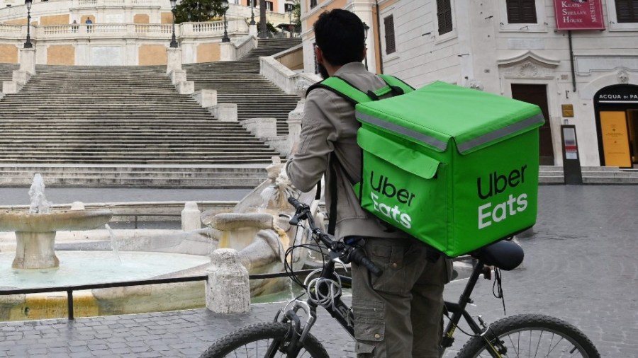 An Uber Eats delivery person in Italy