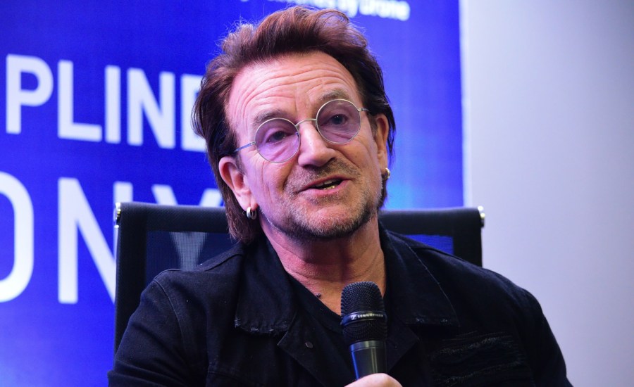 U2 frontman singer Bono speaks to the media during a signing ceremony in Manila on December 10, 2019.