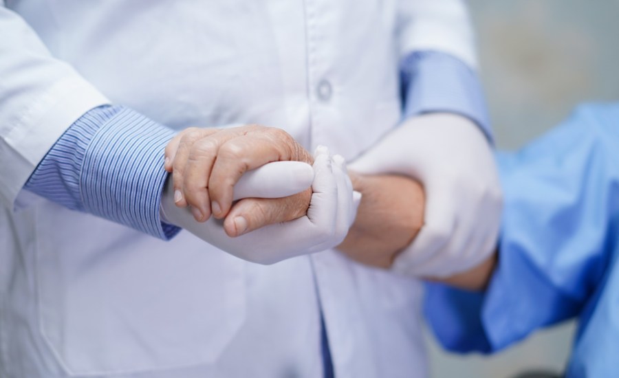 a doctor meets with an elderly patient