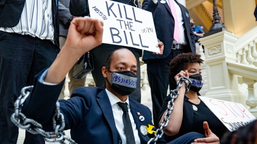 Demonstrators protest in Atlanta against Georgia's sweeping new election law