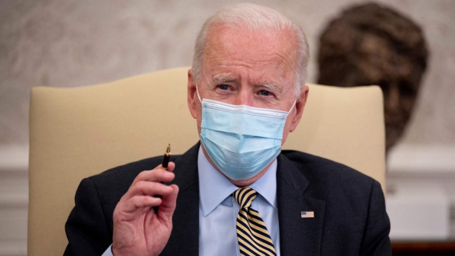 President Biden speaks with reporters while meeting with economic advisers in the Oval Office