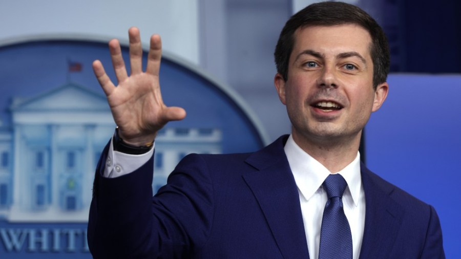 Transportation Secretary Pete Buttigieg speaks with reporters at the White House