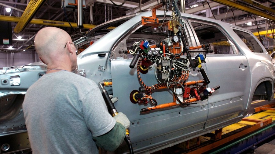 A worker at a GM factory