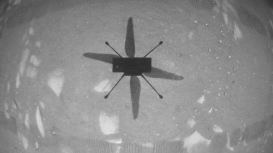 NASA’s Ingenuity Mars Helicopter took this shot while hovering over the Martian surface