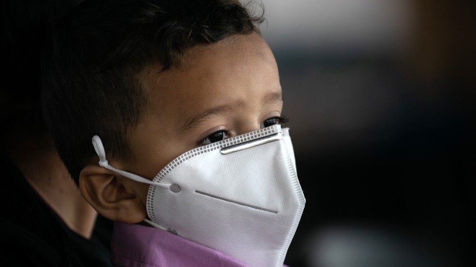 A child waits to be tested for the coronavirus in Brownsville, Texas