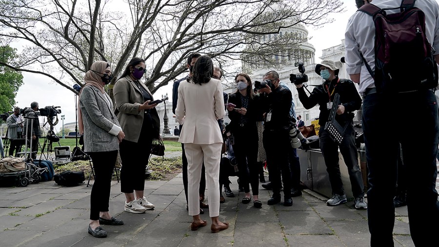 Reporters question Rep. Alexandria Ocasio-Cortez (D-N.Y.) after a press confernce