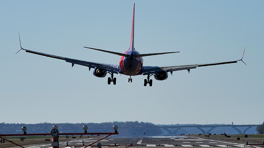 A Southwest Airlines 737 lands at Ronald Reagan National Airport in Arlington, Va.