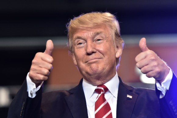 Former President Trump gives two thumbs up