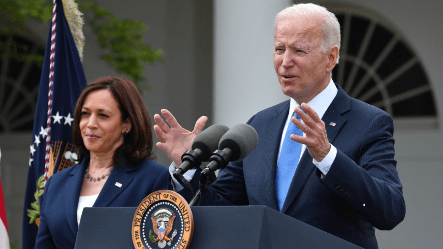 President Biden speaks to the media alongside Vice President Harris in the Rose Garden of the White House