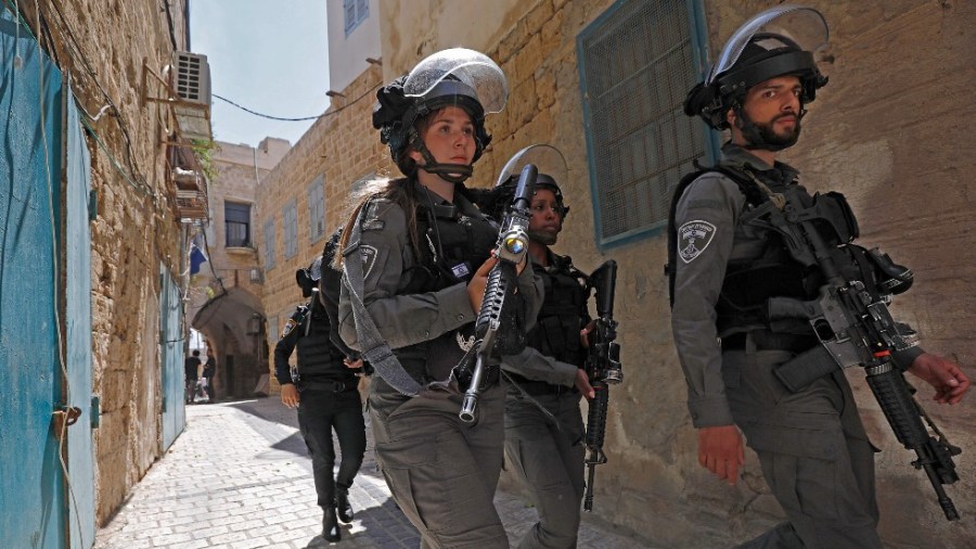 Israeli border guards patrol Acre, a mixed Arab-Jewish town in northwest Israel