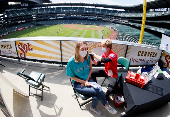 A woman is vaccinated before Seattle Mariners game at T-Mobile Park