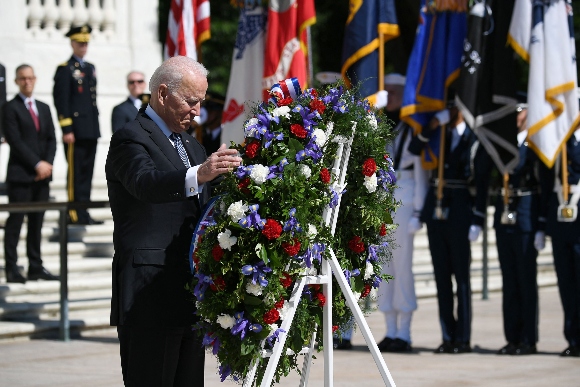 President Joe Biden takes part in a wreath laying in front of Tomb of the Unknown Soldier at Arlington National Cemetery on Memorial Day