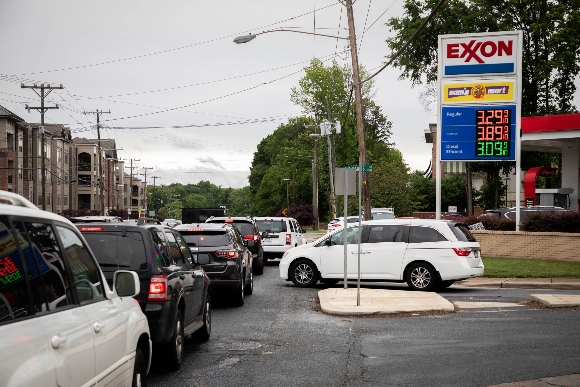 Drivers line up at a gas station