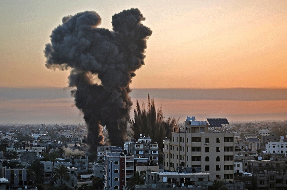 Black smoke billows after a series of Israeli airstrikes targeted Khan Yunis in the southern Gaza strip