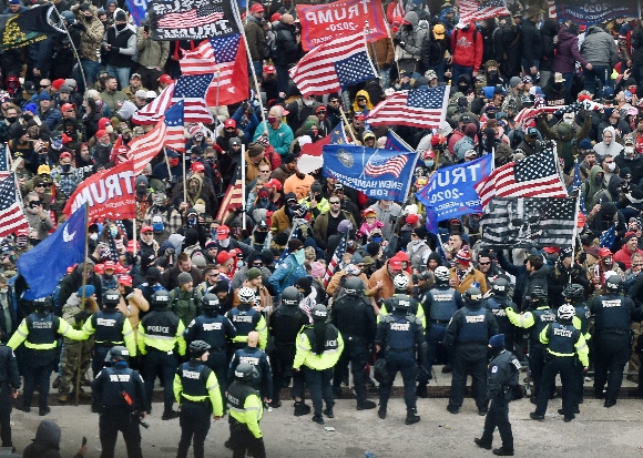 Trump supporters clash with police and security forces as they storm the US Capitol