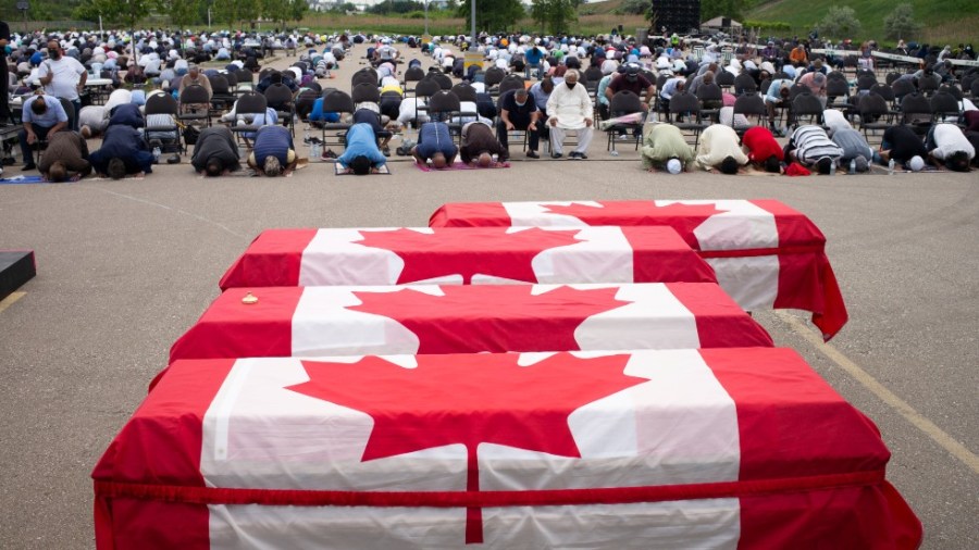 Mourners and supporters gather for a public funeral for members of the Afzaal family at the Islamic Centre of Southwest Ontario