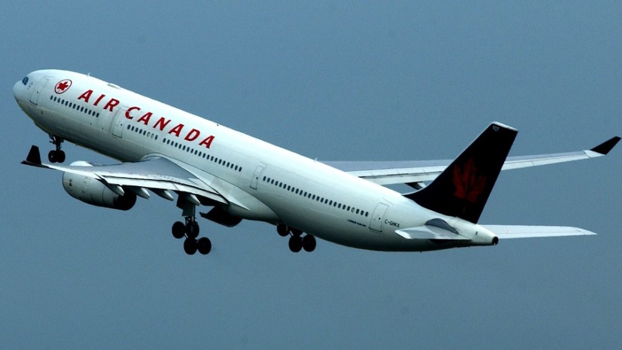 An Air Canada passenger jet takes off from Heathrow Airport in London