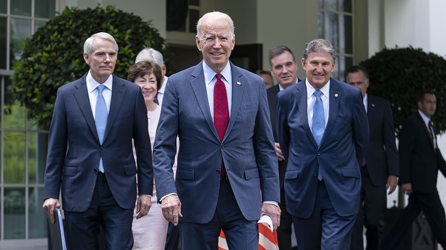 President Biden arrives to speak to reporters outside the White House following a meeting with a bipartisan group of Senators where they reached a deal on the infrastructure plan on June 24