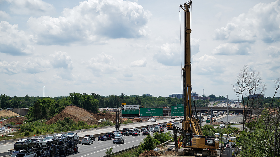 Construction workers are seen on I-66 for a widening project near Fairfax, Va., on June 2