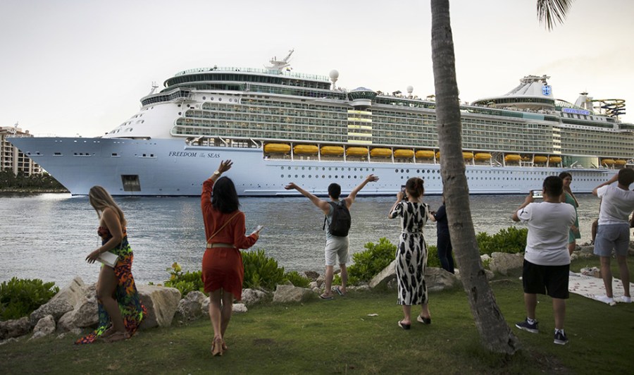 The Royal Caribbean Freedom of the Seas gets underway in front of a crowd in Miami, Florida