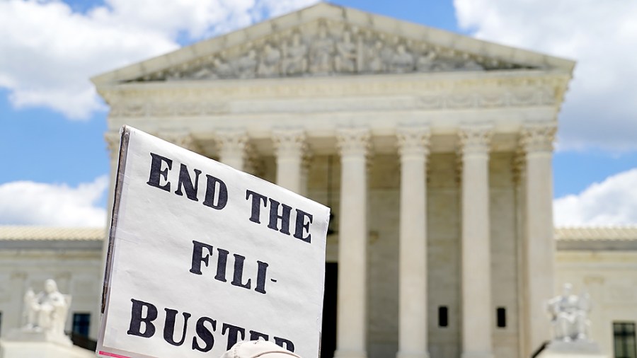 A protester against the filibuster is seen outside the Supreme Court on June 24