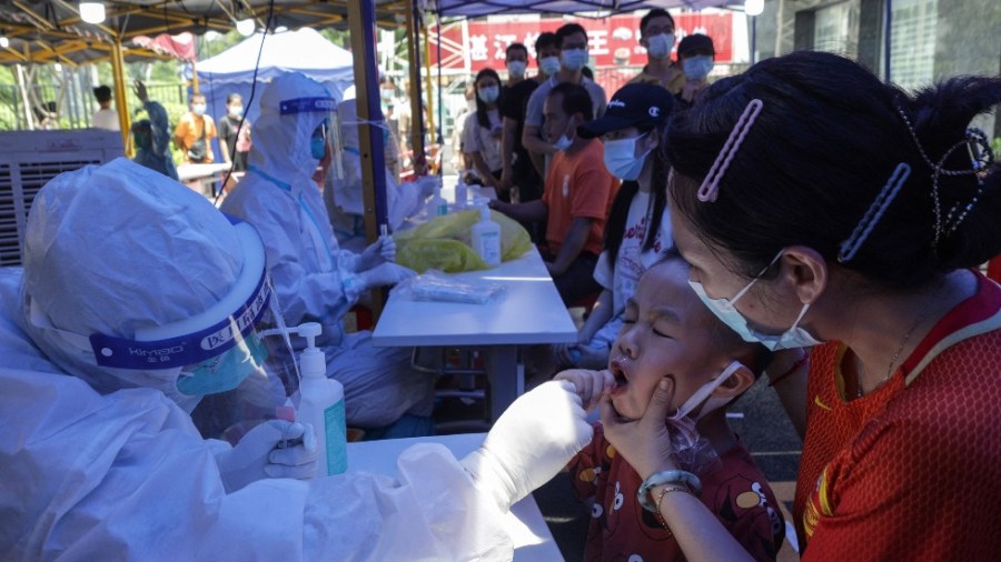 A child receives a coronavirus test in Guangzhou in China's southern Guangdong province