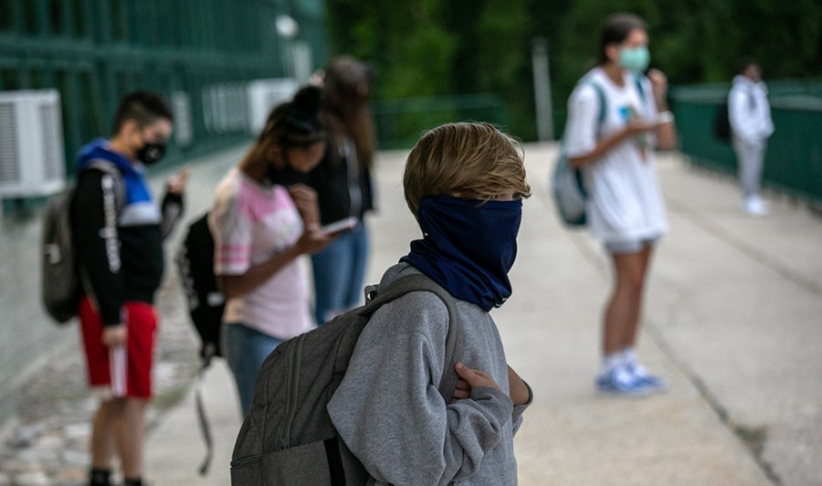 Kids wear masks outside school