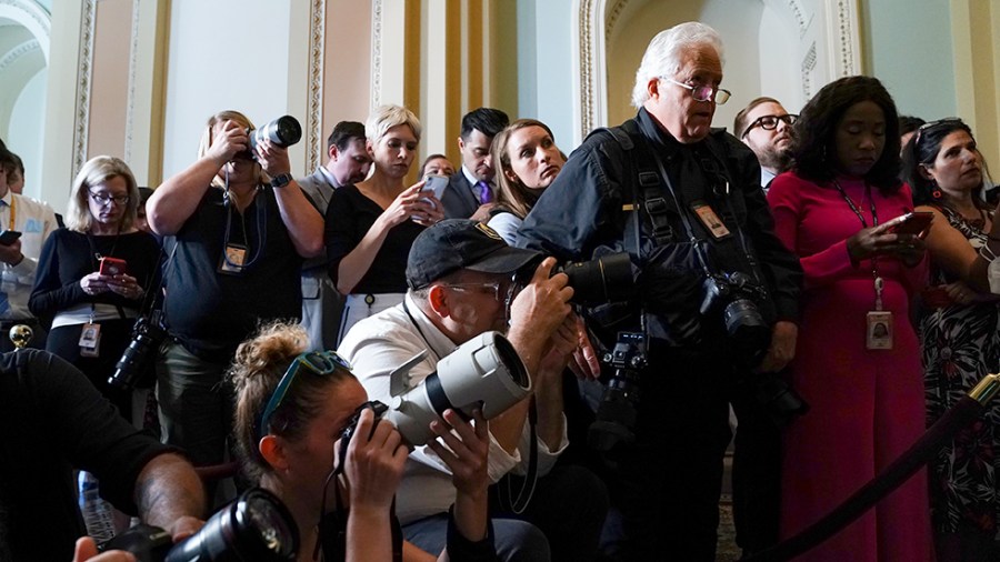 Members of the press are seen at the post-luncheon press conferences on June 15