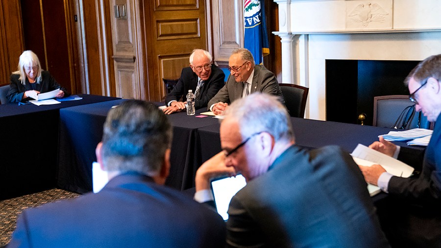 Senate Budget Committee members are seen before a meeting to reconcile the FY 2022 budget on June 16