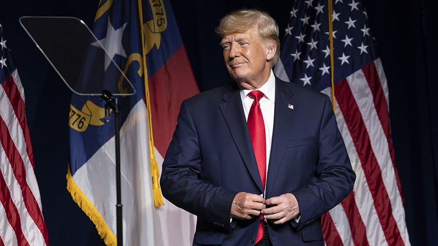 Former President Trump listens to Lara Trump address the North Carolina Republican Party Convention on June 5