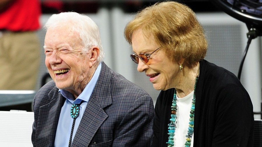 Former President Jimmy Carter and his wife Rosalynn attend an NFL game between the Atlanta Falcons and the Cincinnati Bengals in 2018