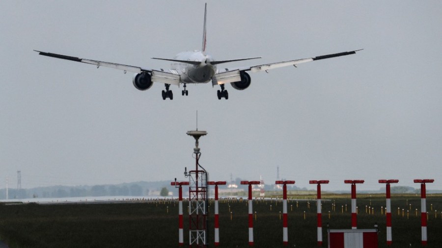 A plane arrives at the Paris Charles de Gaulle Airport