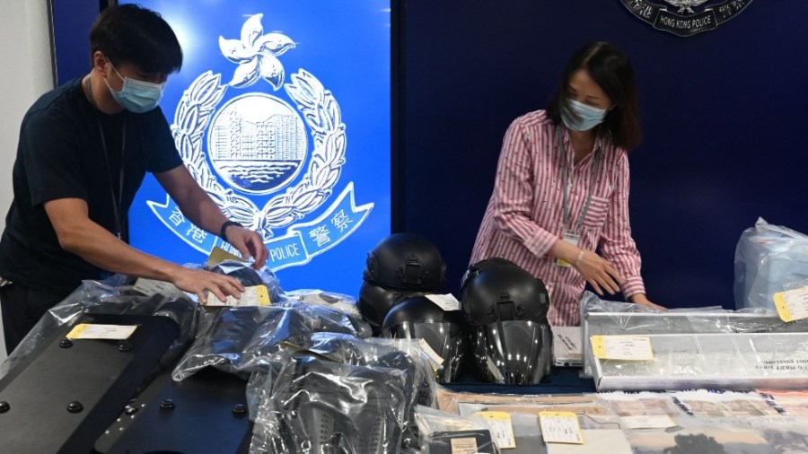 Seized items are put on display at the Hong Kong police headquarters after nine people were arrested on terror charges