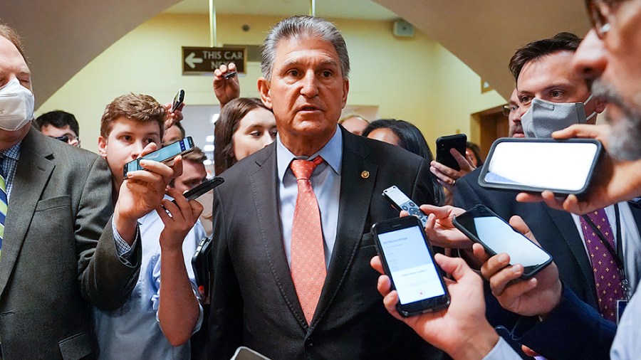 Sen. Joe Manchin (D-W.Va.) speaks to reporters regarding the bipartisan infrastructure negotiations as he arrives to the Capitol for a vote on Wednesday, July 21, 2021.