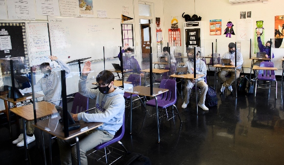 Students attend an in-person English class at St. Anthony Catholic High School during the Covid-19 pandemic