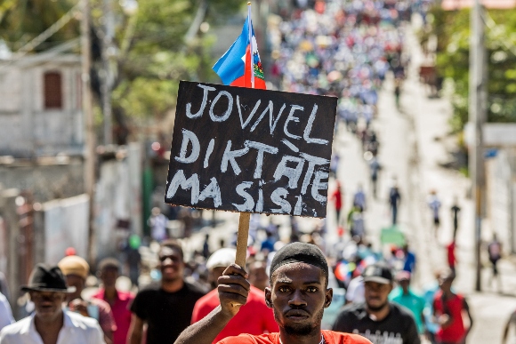 Protesters march in Haiti after president's death