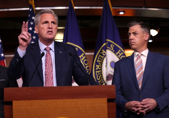 House Minority Leader Kevin McCarthy (R-CA) (L) speaks alongside Rep. Jim Banks (R-IN) at a news conference