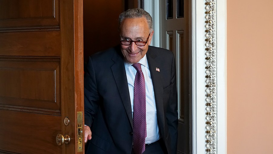 Majority Leader Charles Schumer (D-N.Y.) arrives for a press conference after the weekly policy luncheon on July 13