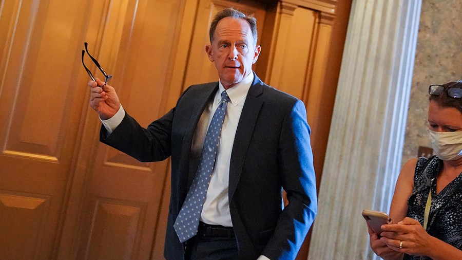 Sen. Pat Toomey (R-Pa.) arrives to the Senate Chamber for a vote regarding a nomination on Thursday, July 22, 2021.