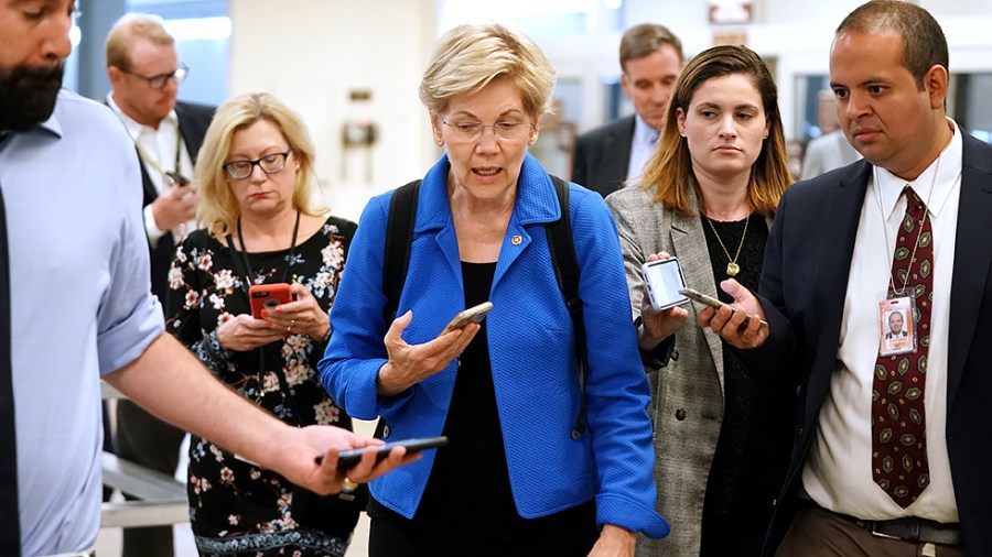 Sen. Elizabeth Warren (D-Mass.) speaks to reporters as she arrives to the Capitol for a vote on Monday, July 19, 2021.